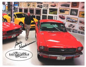 Gale Halderman Stands Beside Mustang In Museum