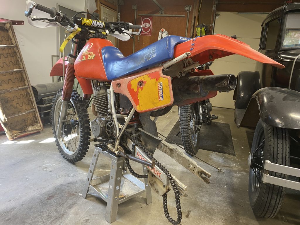 XR250R on stand with rear wheel removed