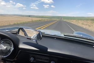 vintage maserati vignale spyder blue skies on open road