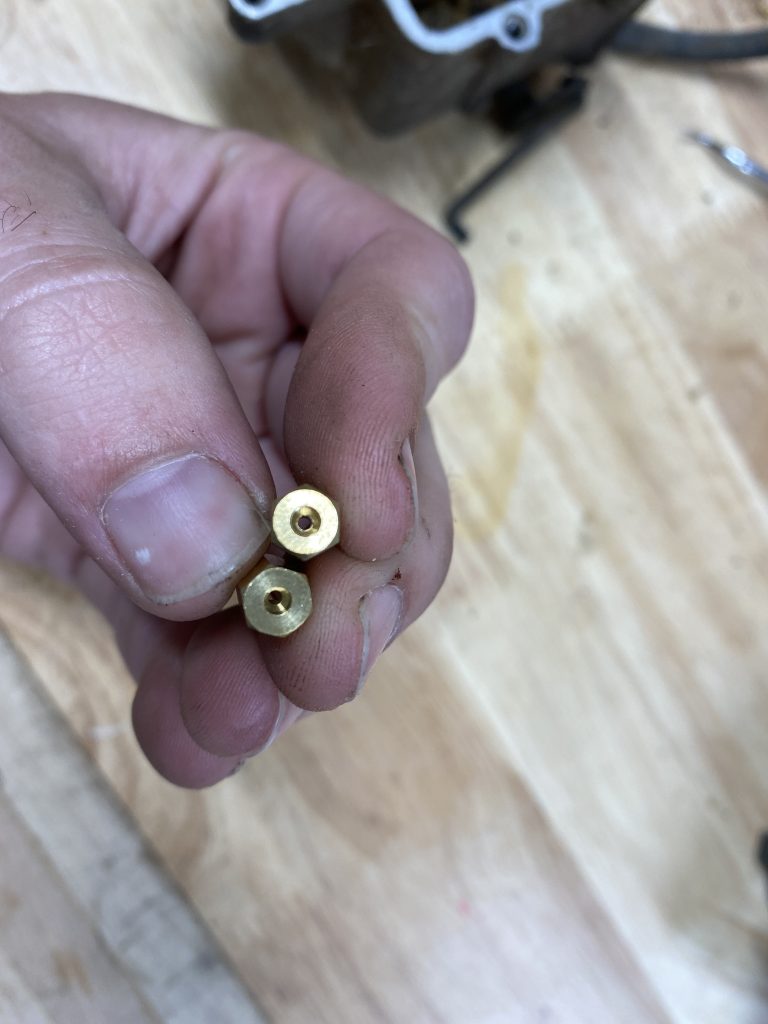 Two carburetor jets side by side Two carburetor jets side by side