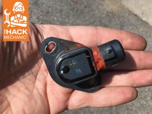 hack mechanic car part in hand