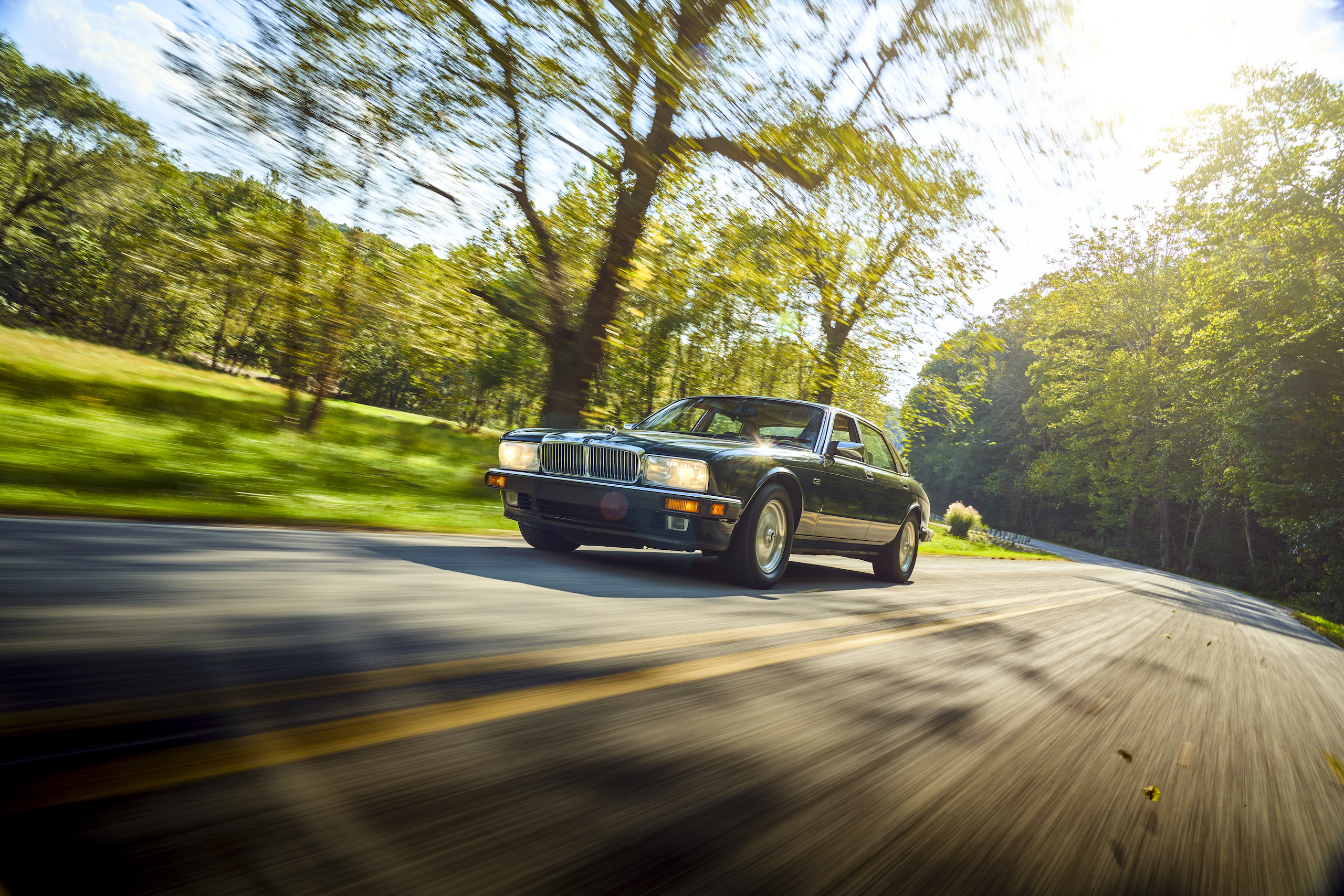 Jaguar XJ6 front three-quarter dynamic road action