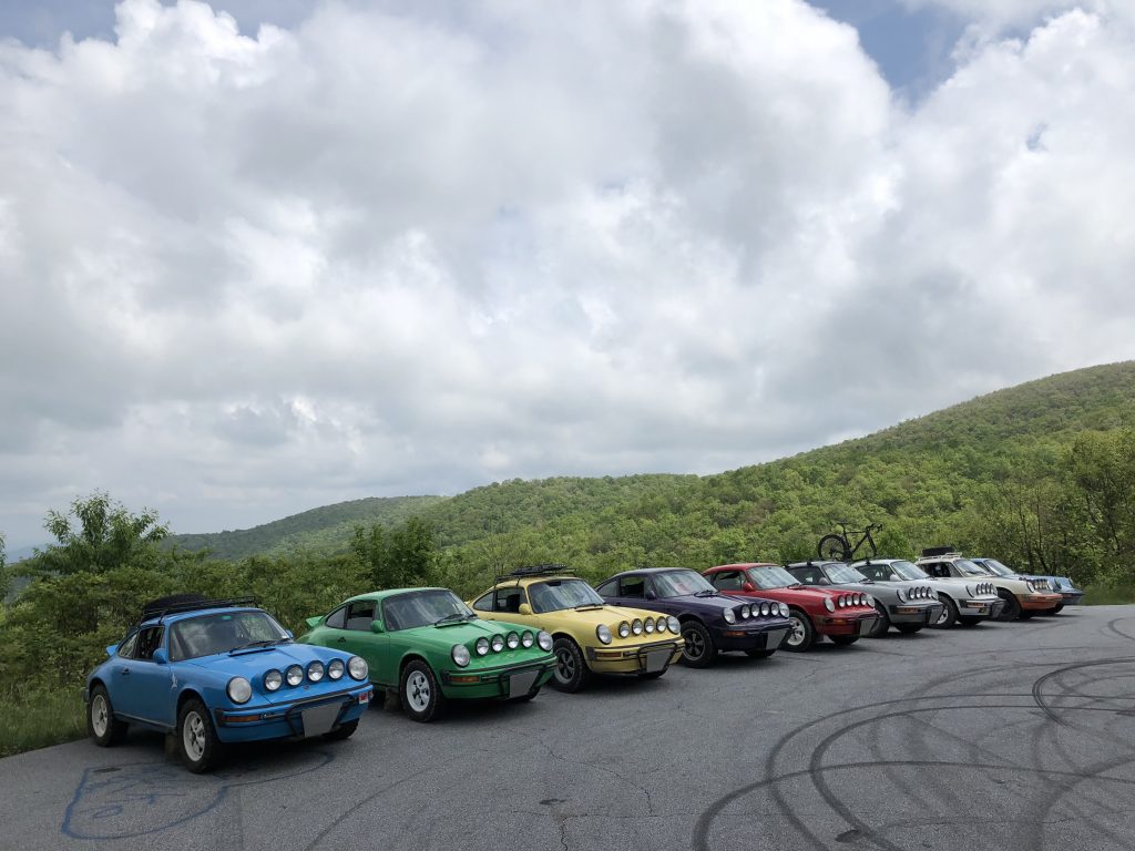 porsche 911 safari cars in row with view