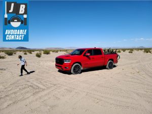 Avoidable Contact Red Ram TLX with bikes and boy in desert