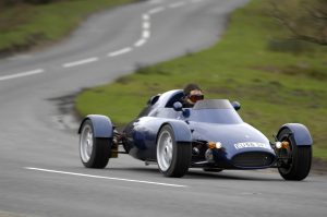 Rocket car front three-quarter dynamic road action