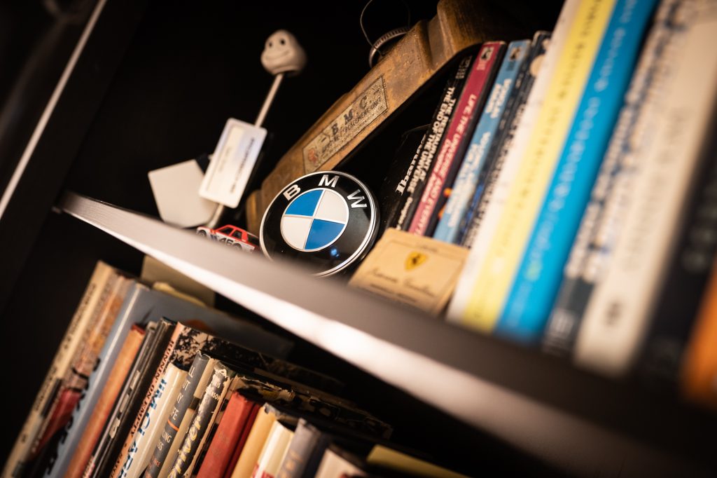bmw logo badge on bookcase shelf