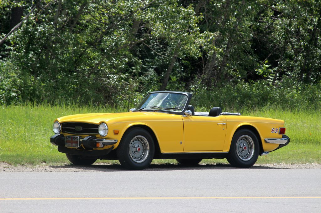 Triumph TR6 Yellow roadster front three-quarter