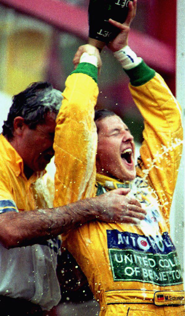 German Formula One driver Michael Schumacher pours