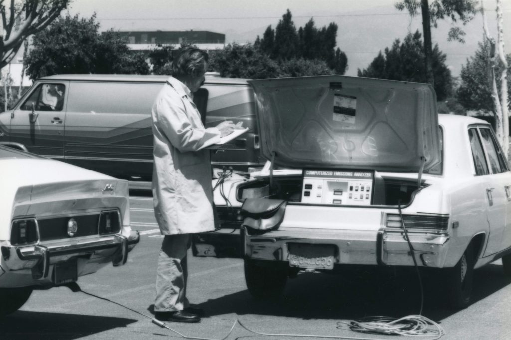 staff member uses a computerized emissions analyzer