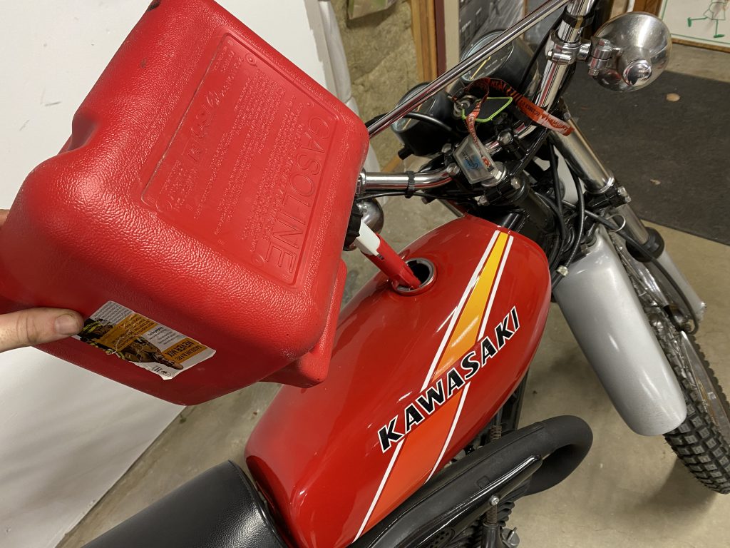 gas can into Motorcycle