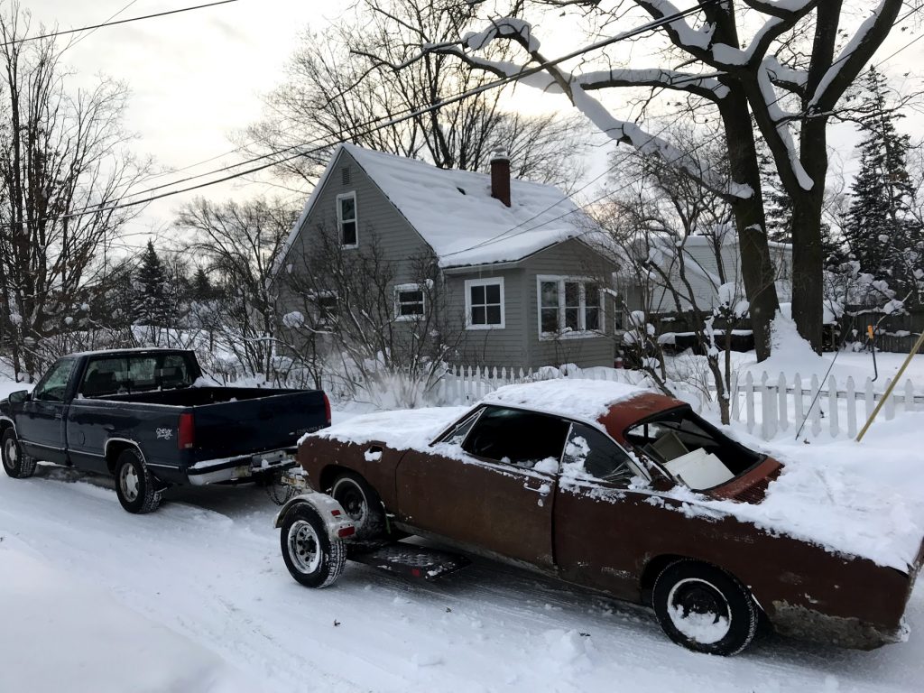 1965 Chevrolet Corvair getting hauled off for scrap