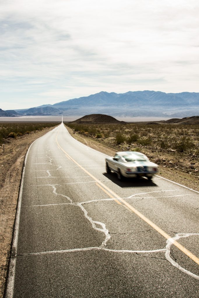 Shelby Fastback open road action vertical rear three-quarter