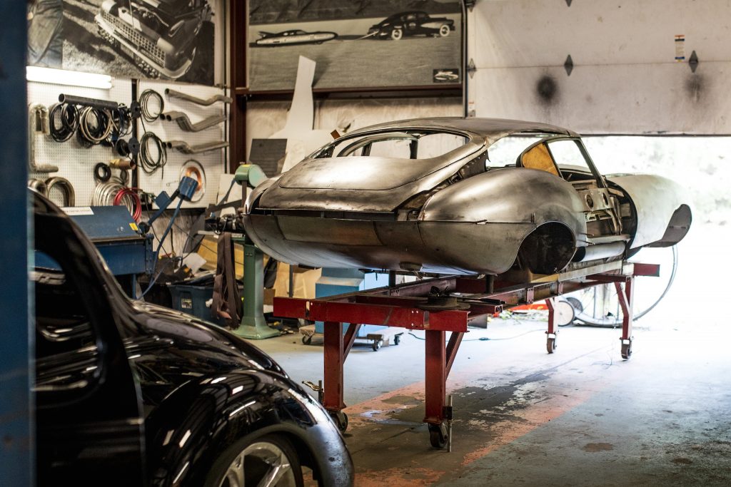 hot rod customs shop E-Type body on stand