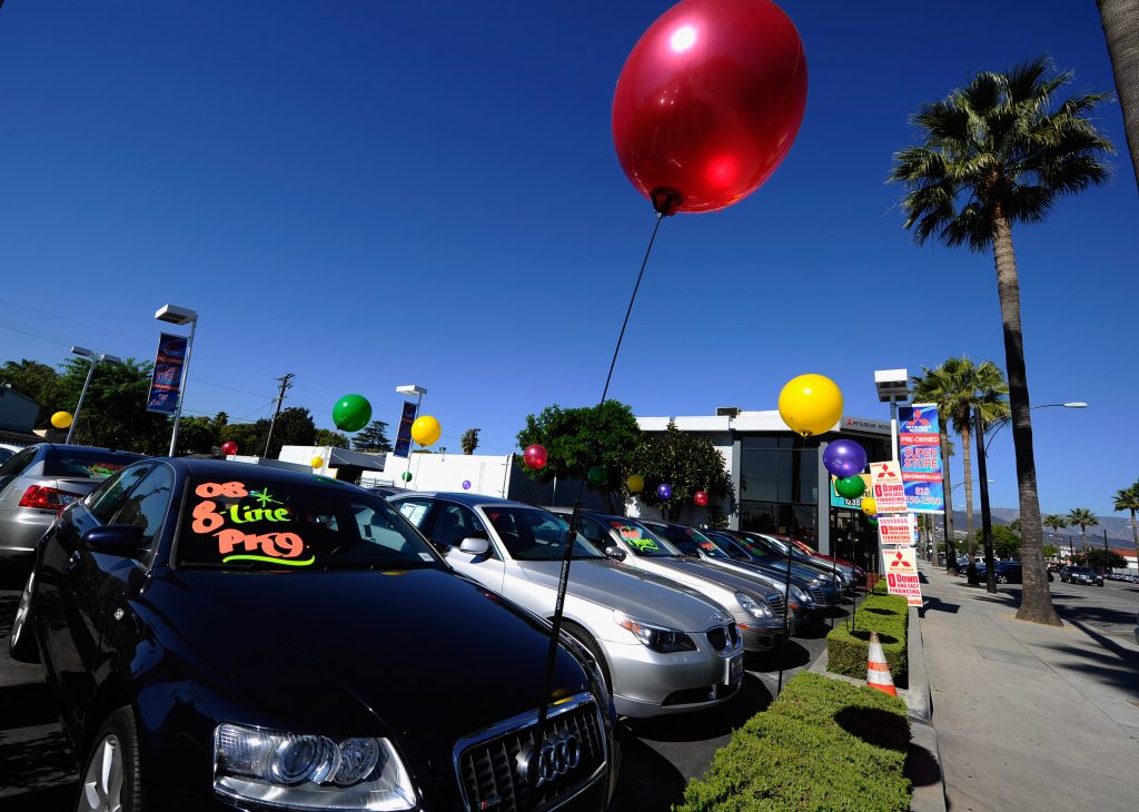 Used car dealership sales lot baloons