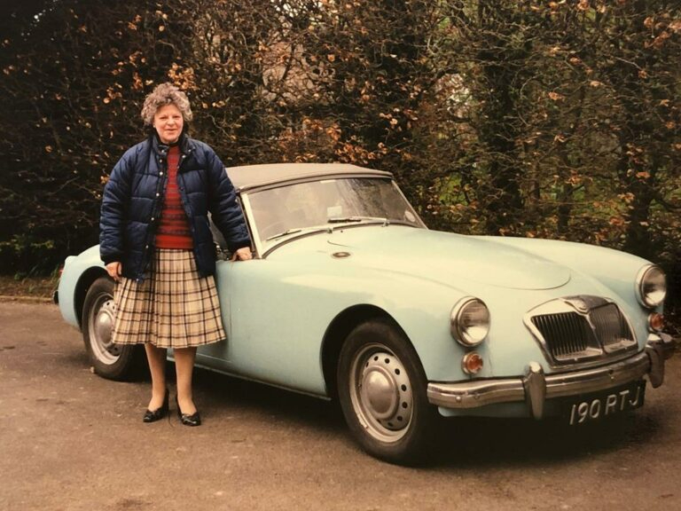1960 MGA roadster owner and car front three-quarter vintage
