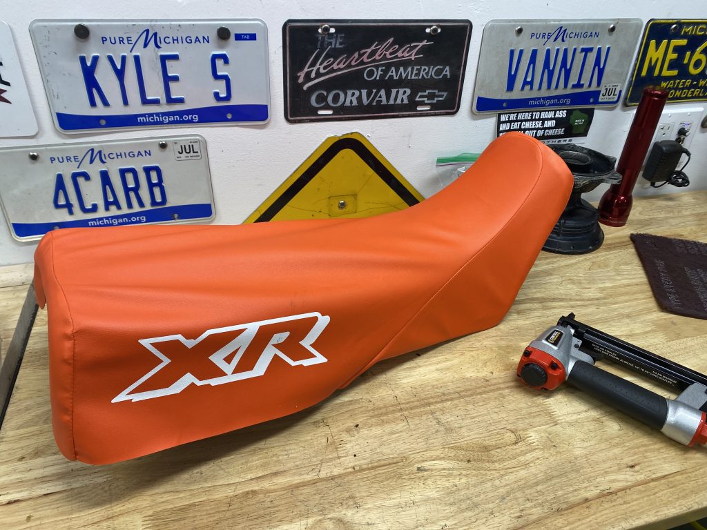 fitting cover on XR250 seat