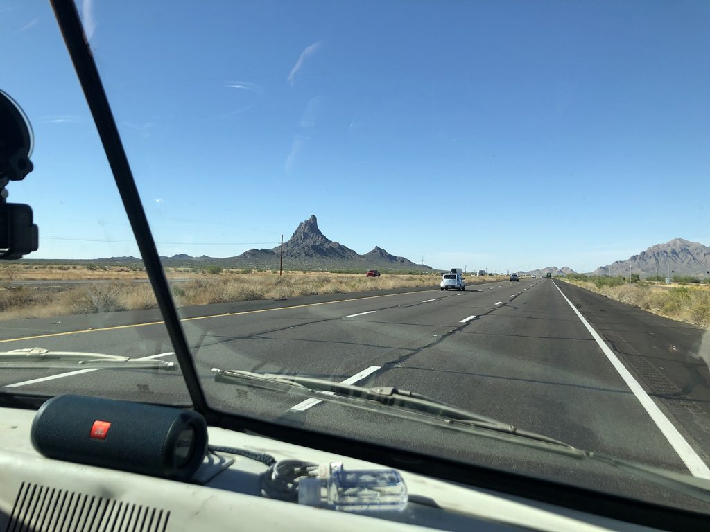 A100 Van rear three-quarter open desert highway three lanes