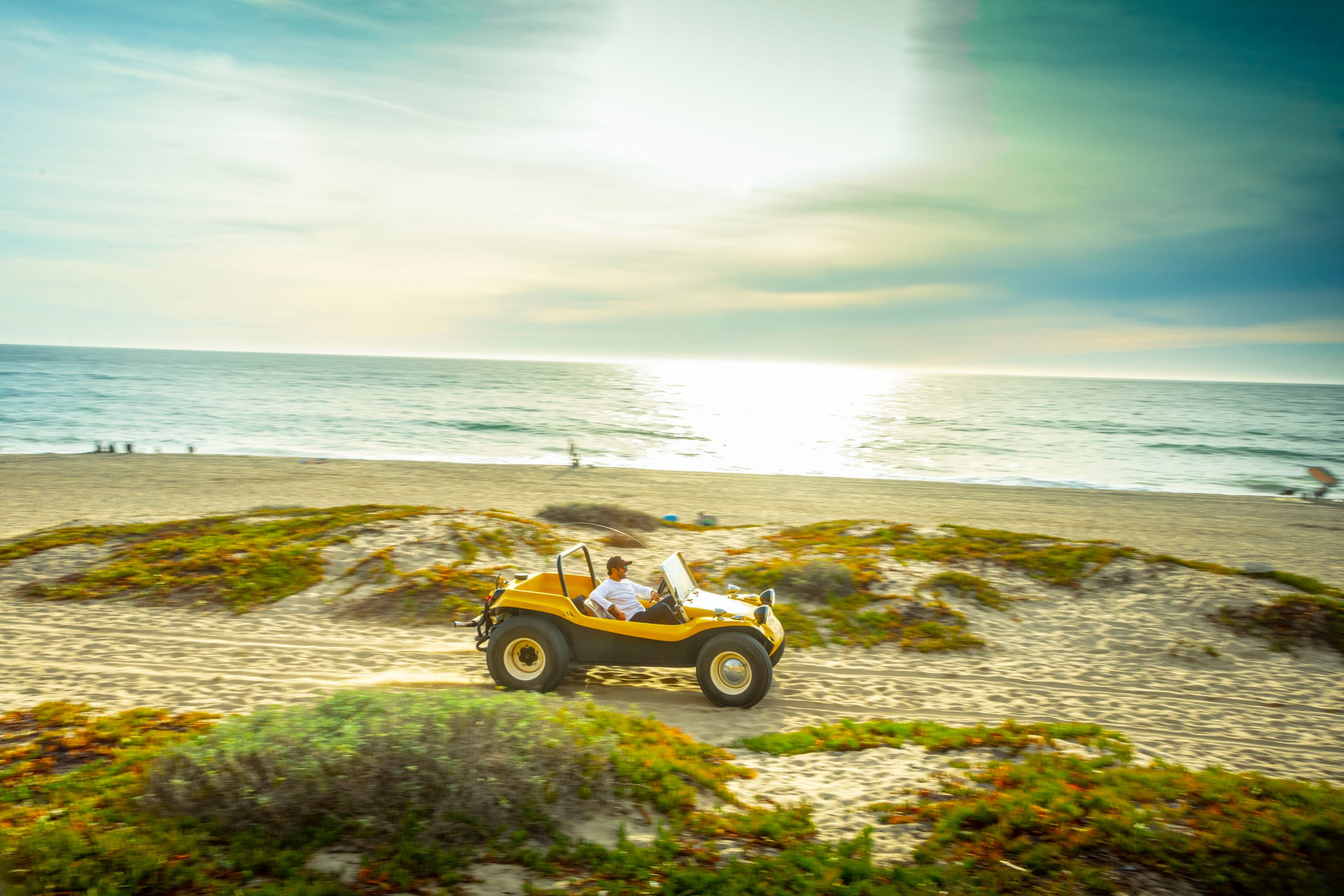 Meyers Manx Dune Buggy side on beach dune driving action