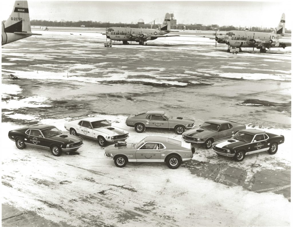 Lawman Boss 429 Ford Mustang historical cars arranged on us air force tarmac