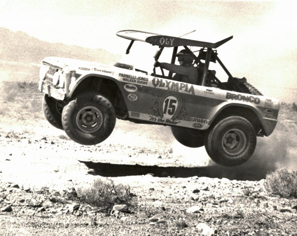 Big Oly Bronco jumping action black and white