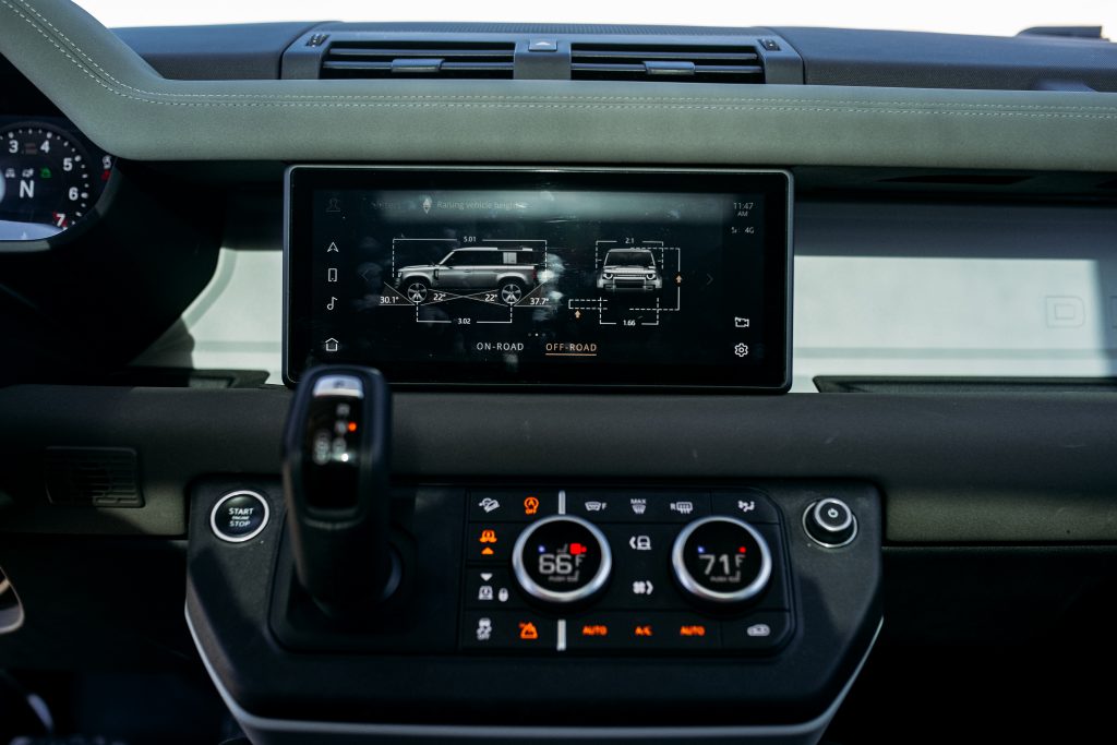 land rover defender interior infotainment screen on dash drive modes