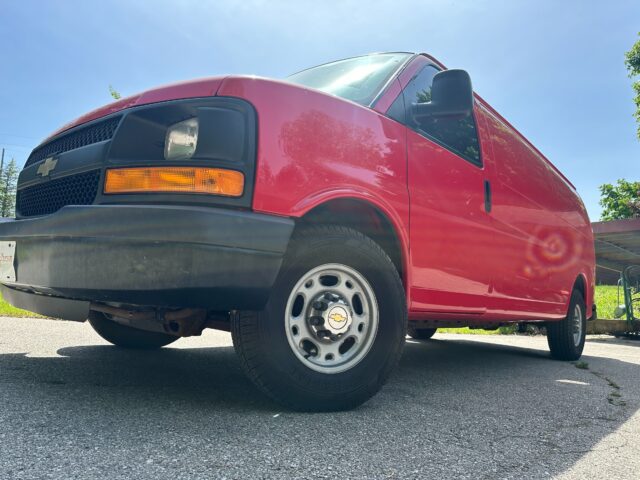Alcoa Aluminum Wheels on a Chevy Express van low front three quarter