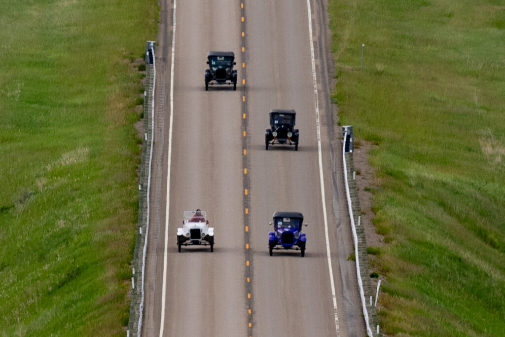 four model Ts driving in Montana 500