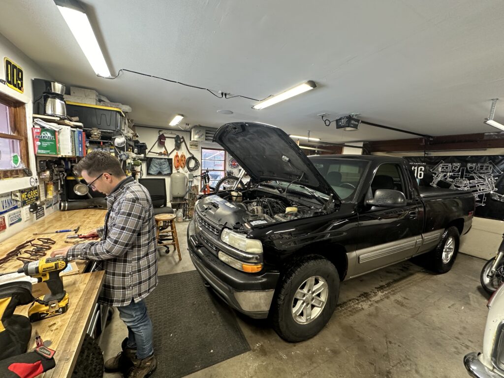 Black Chevrolet Silverado hood open
