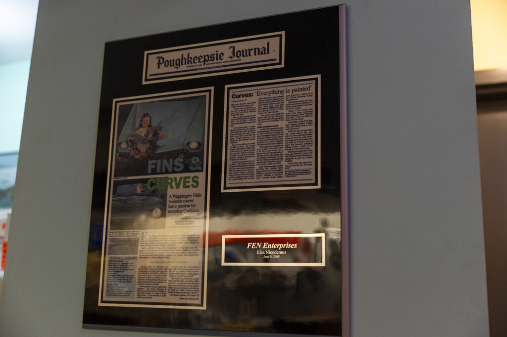 Cadillac parts restoration newspaper press coverage wall shop art