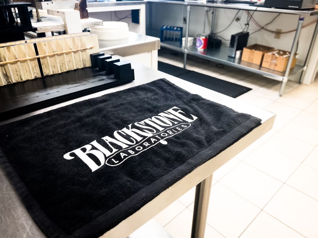 Blackstone Labs in the lab with towel